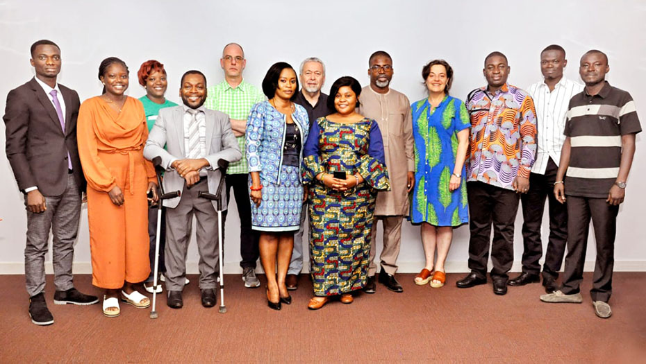 A group of participants in a conference room at an OASIS event.